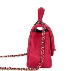 This Mini Top Handle Rectangular flap bag is in fuschia lambskin with light gold tone hardware and has a front flap with signature CC turnlock closure, rear half moon pocket, dark and fuschia top handle and single interwoven fuschia leather and light gold tone chain link shoulder/crossbody strap.The interior is lined in fuschia leather and features a zipper pocket with Chanel pull and an open pocket below.Collection: 2021 (RFID)Origin: FranceCondition: Pre-owned; Mint - This bag retains its shape. The exterior leather is clean with no signs of wear except a few small press marks to back exterior pocket from chain strap. There's no plastic on the hardware but no signs of scratching. The interior leather is clean with no signs of wear.Accompanied by: Chanel box, Chanel dustbag, RFID chip Mea Pink Flap Bag For Formal Occasions, Pink Formal Flap Bag, Pink Leather Double Flap Bag, Designer Pink Double Flap Shoulder Bag, Pink Designer Double Flap Shoulder Bag, Designer Pink Flap Bag With Detachable Strap, Luxury Pink Flap Bag With Detachable Handle, Luxury Pink Flap Bag With Detachable Strap, Elegant Pink Flap Bag With Cc Turnlock Closure