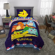 a bed room with a pokemon comforter and pillows