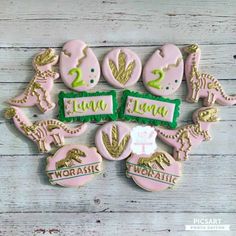 decorated cookies are arranged in the shape of animals and words that spell out love on top of each cookie