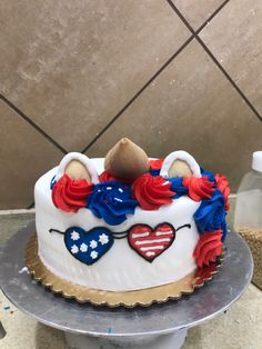 a decorated cake with hearts and flowers on top