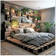 a bed made out of wooden pallets with plants on the headboard and shelves above it