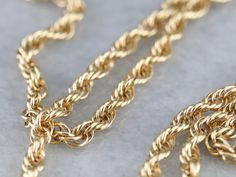 This gold rope twist chain is easily substantial enough to wear alone, but will also work well as a layering piece with beads and other chains. With the right piece, this would make a bold pendant chain as well. Particularly lovely here is the rich color of the gold with plenty of sparkles and shine! Metal: 14K Yellow Gold Width of Chain: 3 mm Length of Chain: 23 Inches Marks: "14K" Stamped on the clasp Yellow Gold Plated Jewelry With Rope Chain, Yellow Gold Rope Chain Necklace, Yellow Gold Plated Rope Chain Necklace, Gold-tone Gold-plated Rope Chain Jewelry, Luxury Gold-tone Rope Chain Jewelry, Chain Layering, Rope Twist, Yellow Gold Necklace, Cameo Ring