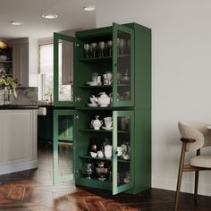 a green cabinet in the middle of a kitchen