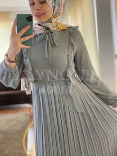 Material :chiffon with amazing underlayer 2layer doesn't need underdress color gray model wearing 42 size her tall 173 cm weight 70 kg Color :baby blue Size 38 40 42 44 46 Length 140 140 141 142 143 Shoulder 38 40 42 42 43 Quantum length 60 62 62 62 62 Bust 90 94 98 102 106 Waist 68 72 76 80 84 Hip 118 118 124 130 136 Chic Gray Ruffled Dress, Gray Pleated Dress For Spring, Chic Gray Dresses With Ruffles, Chic Gray Dress With Ruffles, Modest Dress, Sky Color, Dubai Fashion, Clothing Manufacturer, Under Dress