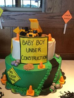 a construction themed cake is displayed on a table