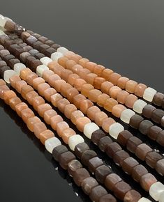 multicolored agate beads with white and brown tips