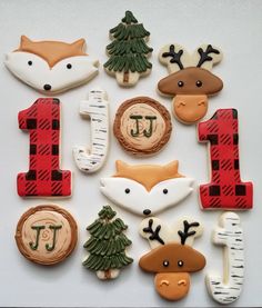 decorated cookies are arranged in the shape of numbers 1 - 5 and animals, including deer, moose, pine tree