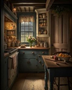 an old fashioned kitchen with blue cabinets and wood flooring is lit by the window