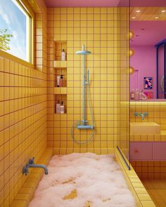 a bathroom with yellow tiles and pink walls