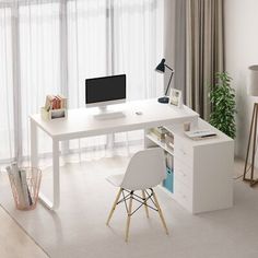 a white desk with a computer on top of it