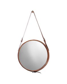 a round mirror hanging from a hook on a white wall with a brown leather strap