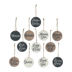 six wooden ornaments hanging from strings with names and words on the front, in different colors