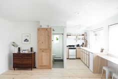 the kitchen is clean and ready to be used as a living room or dining area