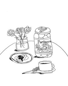 a table with some food on it and flowers in a vase next to the jar