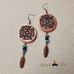 the earrings are made from wood and have feathers, beads, and bead details