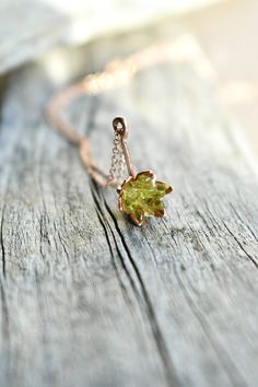 "Peridot and 14k rose gold fill charm necklace. A lotus flower gemstone pendant in pink gold. Green botanical jewelry for all kinds of women! This unique, one of a kind jewelry piece is delicate and dainty, super light on the neck. My rough Peridot is set into an etched rose gold color cup and set into my handcrafted pendant. Finished on an 18\" necklace. Also available in any gemstone or crystal. Custom orders are totally welcomed. Ships worldwide within 10 days. Scroll to read more. *My 14K ro Fine Jewelry Rose Gold Birth Flower, Fine Jewelry In Rose Gold With Birth Flower Detail, Rose Gold Fine Jewelry With Birth Flower, Delicate Green Jewelry With Birth Flower, Rose Gold Flower Pendant Jewelry With Birthstone, Rose Gold Birthstone Flower Pendant Jewelry, Delicate Green Birth Flower Jewelry, Rose Gold Flower Shaped Birthstone Jewelry, Nature-inspired Rose Gold Jewelry Gift