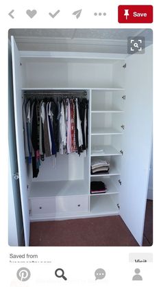 an open closet with clothes hanging on the shelves