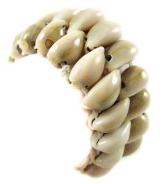 PRICES MAY VARY. This Cowrie Shells Bracelet is polished to a high gloss to reveal their beautiful natural patterns. All the shell pieces are strung together by 2 Sturdy Elastic Strings for one size fits most! A super crisp and smart accessory for you. Shell Type: Cowrie Shells Bracelet Size: 6 to 8 inch (stretchable ) Bracelet Width: 0.8 inch (20mm) This Cowrie Shells Bracelet is polished to a high gloss to reveal their beautiful natural patterns. All the shell pieces are strung together by 2 S Bohemian Shell Oyster Bracelet, Bohemian Shell Bracelets With Oyster Detailing, Handmade Beige Bracelets For Vacation, Adjustable Beige Shell Jewelry, Cream Shell-shaped Shell Jewelry, Shells Bracelet, Cowrie Shell Bracelet, Cowry Shell, Beach Surfing