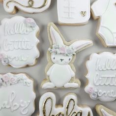 decorated cookies with the words hello little one written in cursive letters and an image of a bunny