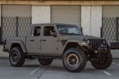 a jeep parked in front of a building