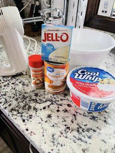 ingredients to make an ice cream dessert sitting on a counter