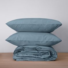 three pillows stacked on top of each other