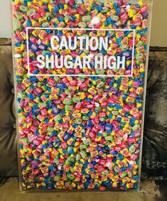 a sign that says caution, shugar high surrounded by lots of sprinkles