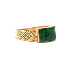 This one of a kind Mid-Century jade ring features a diamond and dot geometric engraved pattern in 14 karat yellow gold. The natural green jade reflects forest green hues. Set in channel bars. A vintage statement ring to admire. The cabochon cut gem is accented by engraved shoulders on a tapered 14K yellow gold band. The ring measures 6mm wide. A stunning gift for you or your loved one. The iconic birthstone of March. Antique Yellow Gold Emerald Ring, Antique Emerald Ring In Yellow Gold, Antique 14k Gold Emerald Ring, Antique Emerald Ring In 14k Gold, Antique Engraved Emerald Ring For Formal Occasions, Antique Green Diamond Ring For Formal Occasions, Antique Emerald Ring In Stamped 14k Yellow Gold, Art Deco 14k Gold Emerald Ring, Heirloom Emerald Ring Stamped 14k