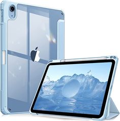 an ipad case and tablet cover are shown in front of each other, with mountains behind them