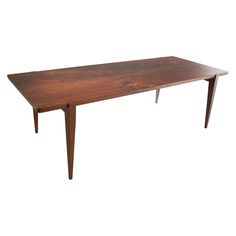 a wooden table sitting on top of a white background