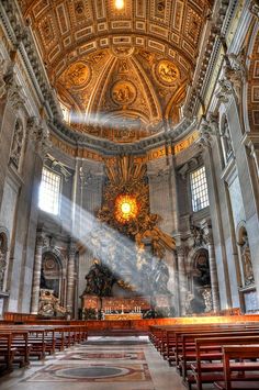 the inside of an old church with pews