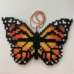 a black and orange butterfly made out of legos