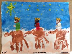 a child's drawing of three children riding horses with crowns on their heads and holding hands in the air