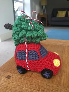 a crocheted car with a christmas tree on top