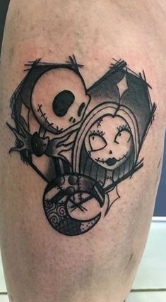 a couple of tattoos on the legs of someone's leg, one with a skull and