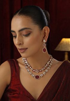 Elevate your style with this Red Polki Layered Necklace set, featuring vibrant red stones intricately set in traditional Polki design and enhanced with a stunning rose gold finish. The multi-layered arrangement adds depth and sophistication, while the warm rose gold accents beautifully complement the rich red hues. Perfect for weddings, or any special occasion, this necklace set exudes timeless elegance and contemporary charm. Polki Necklace Set, Red Stones, Polki Necklace, Rose Gold Accents, Layered Necklace Set, Red Stone, Layered Necklace, Vibrant Red, Gold Accents