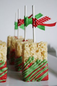 christmas rice krispy treats with green and red frosting on white plate, ready to be eaten