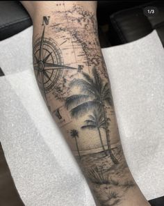 a man's arm with a map and palm trees on it