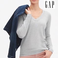 Gap Women's V-Neck Pullover Soft Knit Light Sweater Top In Grey Straight Silhouette With An Easy Fit. Hits Below The Hips. Soft Knit. Long Sleeves With Rubbed Cuffs, Hem. Ribbed V-Neck. #931205 100% Cotton. Machine Wash. Armpit To Armpit Xs: 18.5"; S: 19" Total Length Xs; 24"; S: 24.5" Classic Gap Tops For Fall, Classic Winter Tops From Gap, Classic Gap Tops For Winter, Gap V-neck Tops For Fall, Gap V-neck Fall Sweater, Gap Tops For Winter Layering, Casual Gap V-neck Sweater, Casual V-neck Sweater By Gap, Gap Sweater For Spring Layering