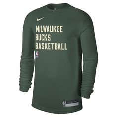 Represent your Milwaukee Bucks with the unisex Nike hunter green Milwaukee Bucks 2023/24 Legend on-court practice long sleeve T-shirt. This official team apparel features screen print graphics and a heat sealed jock tag, showcasing your unwavering support for the Bucks. Made with at least fifty-five percent recycled content, this sustainable T-shirt aligns with Nike's Move To Zero initiative, demonstrating your commitment to both the team and the environment. Heat sealed jock tag Crew neck Long Sportswear Top With Team Logo For Streetwear, Nike Tops With Letter Print For Team Events, Moisture-wicking Green Top For Team Events, Green Moisture-wicking Top For Team Events, Nike Green T-shirt For Streetwear, Green Sportswear Sweatshirt With Letter Print, Green Crew Neck Top With Team Logo, Green Casual Tops For Team Events, Green Letter Print Sweatshirt In Sportswear Style