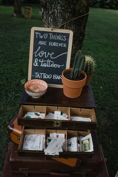 an old trunk is used as a table for cards and other things to write on