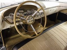 the interior of an old car is clean and ready to be used