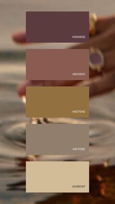 a person's hand holding onto the water with color swatches on it, including brown and beige