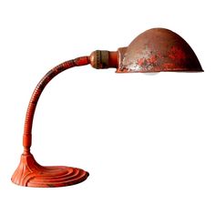 an orange desk lamp with a wooden base and metal shade on the arm, against a white background