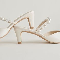 Just in time for wedding season. KANIKA is a dream in pearls, and perfect for all day and night wear. Whether you're a guest or are tying the knot yourself, these are THE must-have shoes for any event. Textile + Pearl Upper Recycled Synthetic Outsole Water-based Leather Alternative Lining Leather Sock 2.3" Heel Height Imported