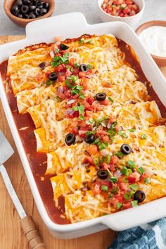 A casserole dish of enchiladas topped with melted cheese, fresh pico de gallo, black olives, and green onions, served on a wooden table with sides of sour cream and salsa. Restaurant Style Enchiladas, Mexican Beef Enchiladas, Enchilada Filling, Southwest Food, Ground Beef Enchiladas, Easy Enchiladas, Leftover Beef, Breakfast Crescent Rolls, Mexican Beef