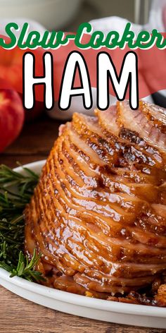 a close up of a plate of food on a table with the words slow cooker ham