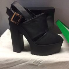 Black Platforms With Wrap Around Ankle Strap. Trendy Black Sandals With Chunky Platform, Trendy Black Chunky Platform Sandals, Black Platform Sandals With Pointed Toe, Trendy Black Platform Heels, Black Sandals With Buckle Closure For Fall, Black Buckle Closure Sandals For Fall, Casual Sandals For Fall Party, Trendy Black Evening Sandals, Black Sandals For Night Out