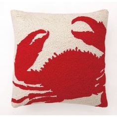 a red crab pillow on a white background