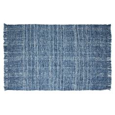 a blue rug with fringes on it